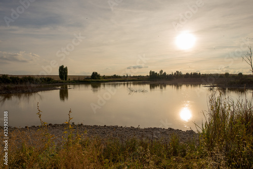 Sunset in a reservoir of daimiel tables