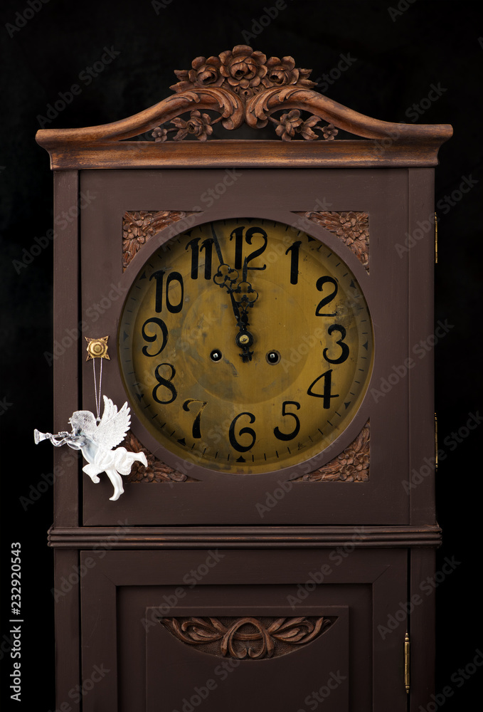 Antique clocks and Christmas Angel. Celebration Concept for New Year..