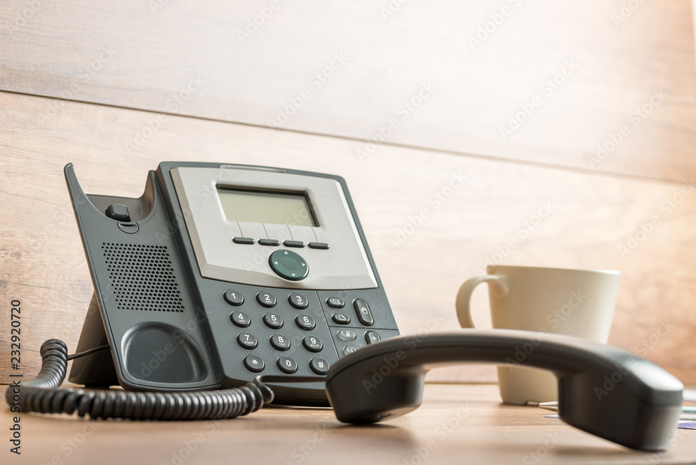 Black landline telephone with handset off line Black landline telephone with handset off line