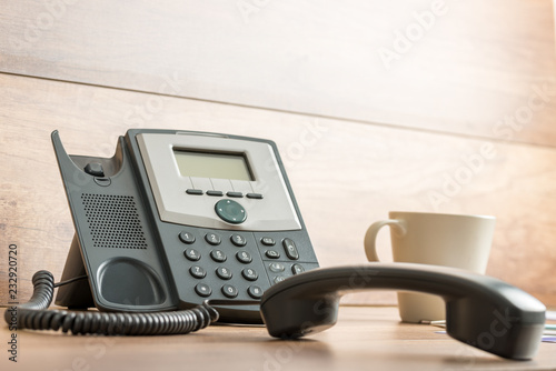 Black landline telephone with handset off line photo