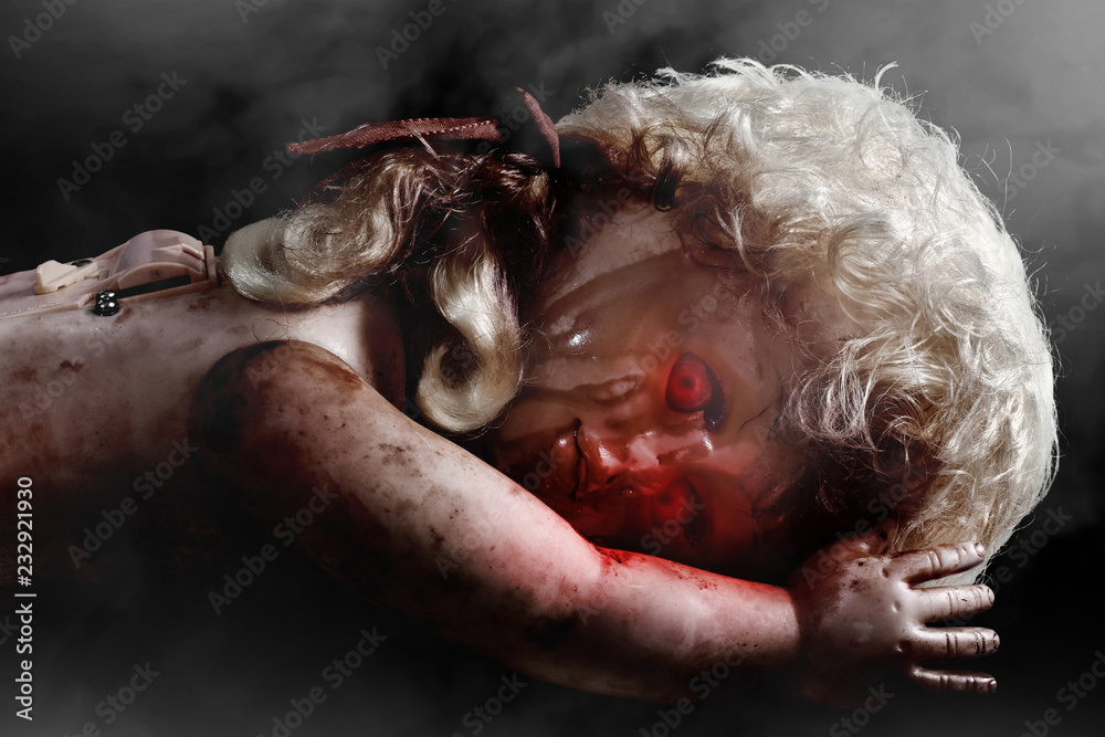 Obraz premium Scary bloody doll with red eyes