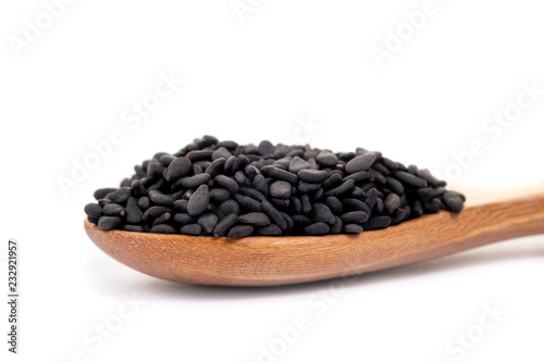 Close up black organic sesame on white background. Health food concept.