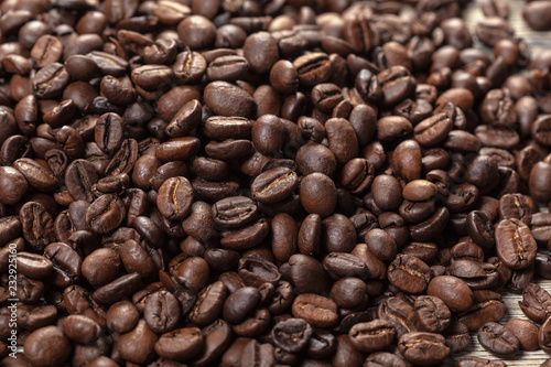 Coffee beans on wood background