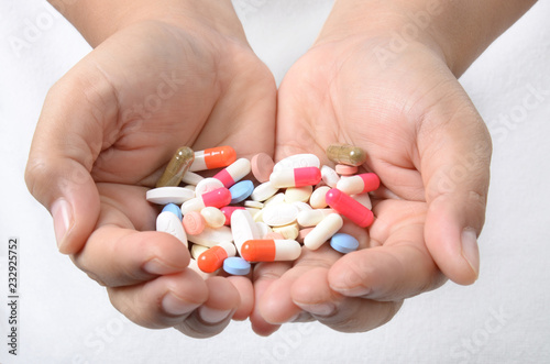 Close-up of hands holding pills