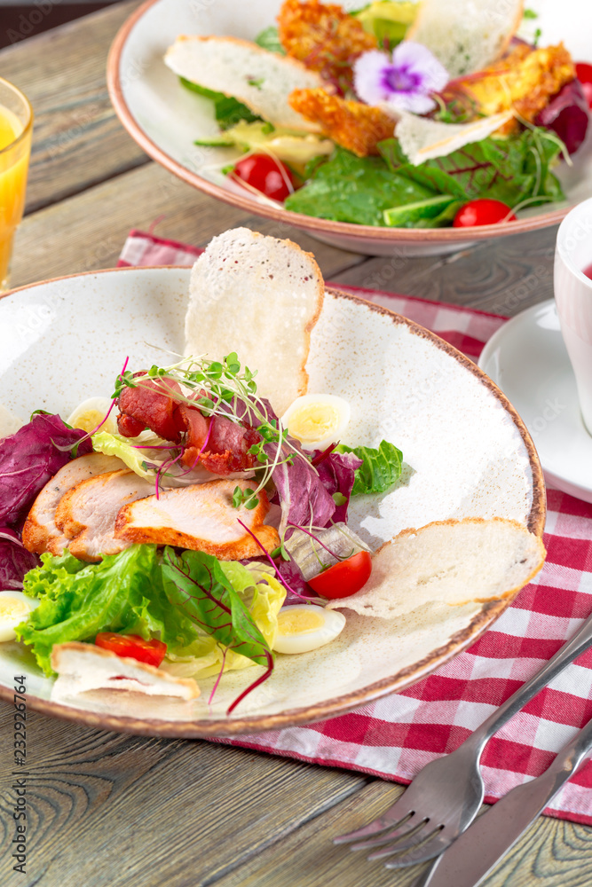 Fresh salad with chicken breast, arugula and tomato. Top view Fresh salad with chicken breast, arugula and tomato. Top view