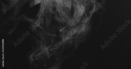 closeup vapor floating in air on black background