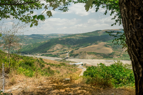 Landscape with mountain and river with natural Tree Leaves Border or frame. Place for copyspace. photo