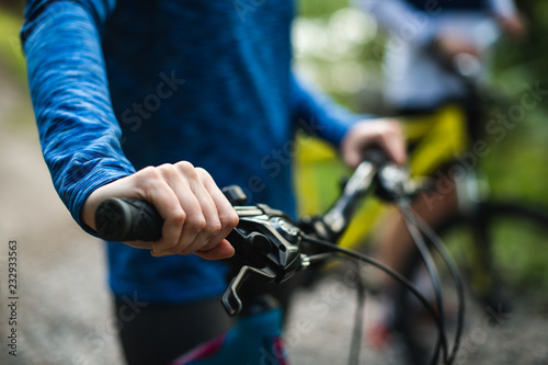 Closeup of cyclist holding a bike handlebar