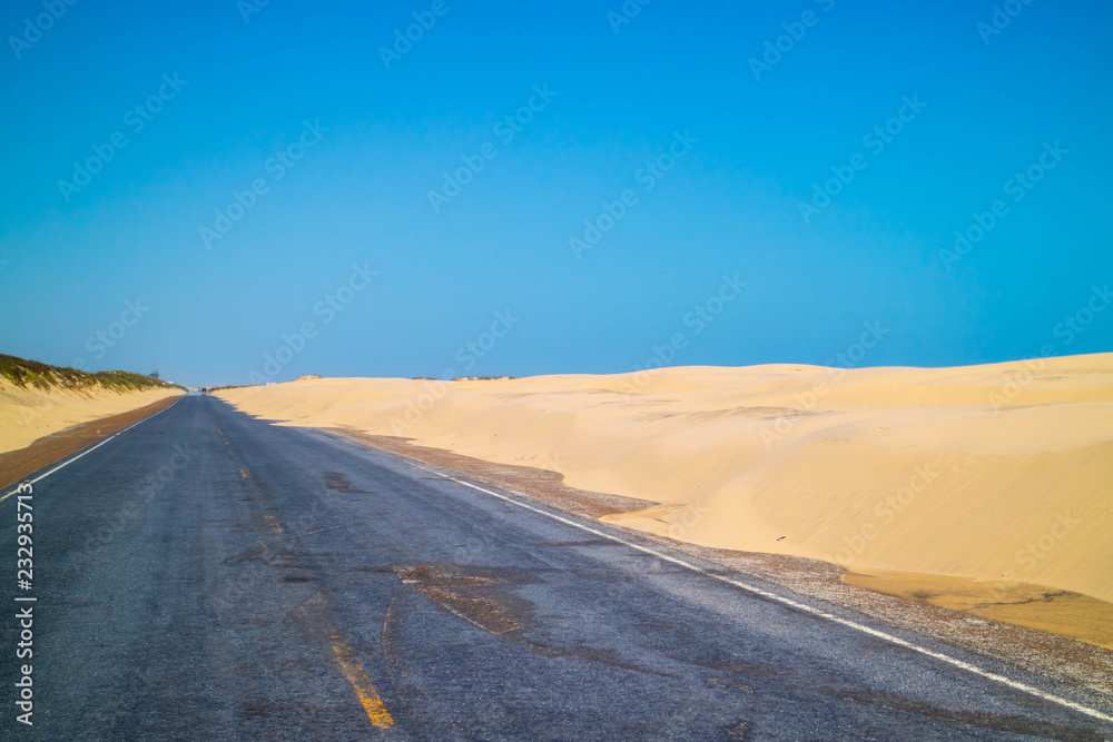 Fototapeta premium A long way down the road of South Padre Island, Texas