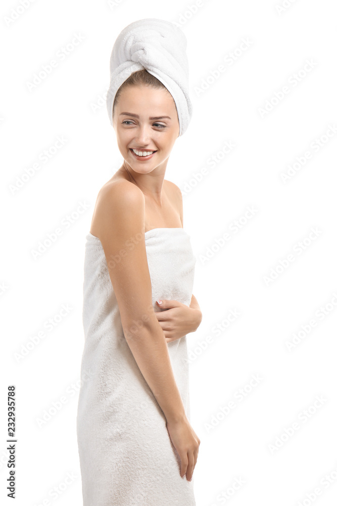Beautiful young woman wrapped in towel on white background Beautiful young woman wrapped in towel on white background