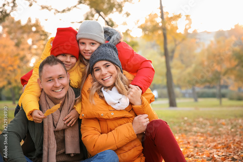Happy family in autumn park