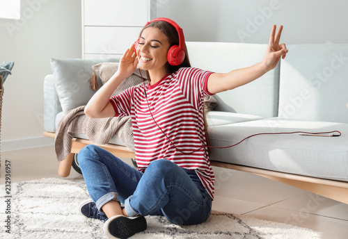 Beautiful woman listening t...