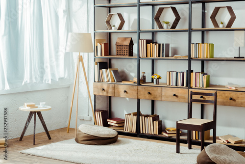 interior of living room with wooden furniture and books photo