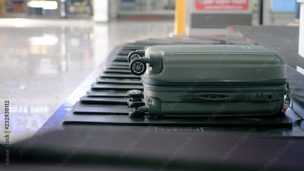 Airport baggage claim with luggage spinning around conveyor