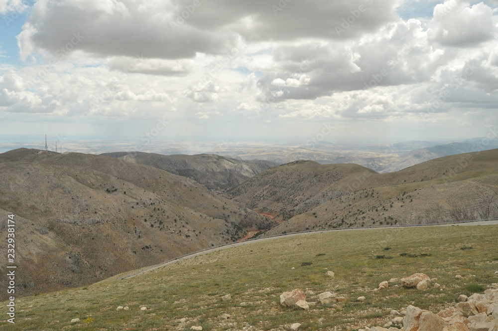 Naklejka premium Nemrut Dagi. Mountains on the background of sky. Vertices covered with snow. Tourism and travel.