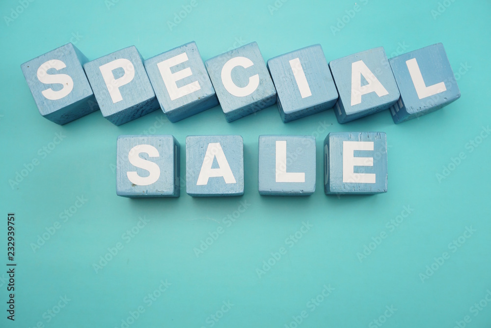 Obraz premium Special Sale word created with cubes alphabet letters on blue background