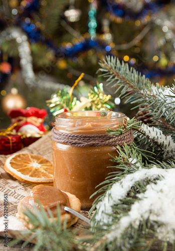 Jar of salt caramel and Christmas New Year decorations.
