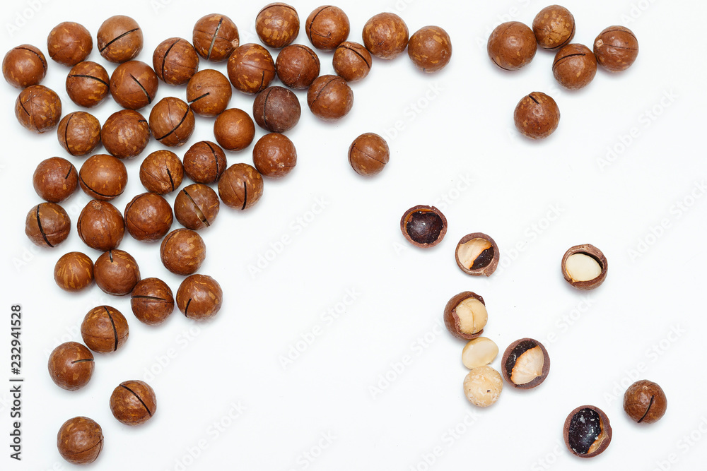 Macadamia nuts on white background. Top view. Macadamia nuts on white background. Top view.