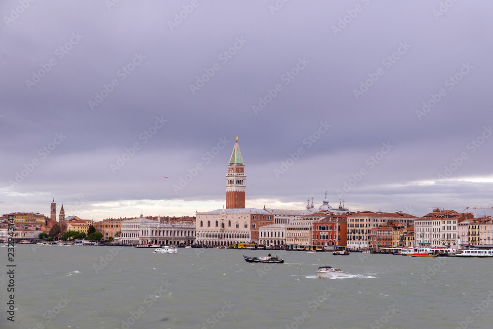 VENICE, ITALY- OCTOBER 30, 2018: St Mark's Campanile is the bell tower of St Mark's Basilica in Venice Marco. It is one of the most recognizable symbols of the city. view from the sea