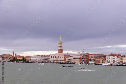 VENICE, ITALY- OCTOBER 30, 2018: St Mark's Campanile is the bell tower of St Mark's Basilica in Venice Marco. It is one of the most recognizable symbols of the city. view from the sea © villorejo