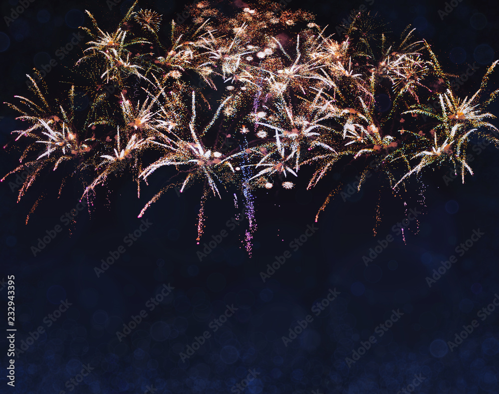 Brightly Colorful Fireworks on black background with beautiful bokeh