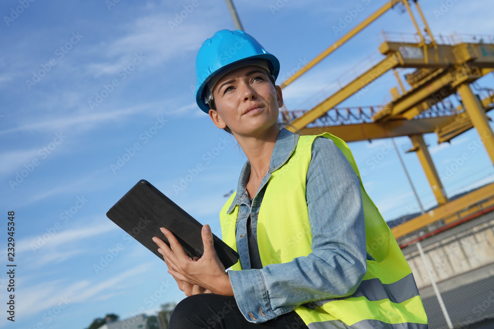 Woman on a building site making sure everything is going well Woman on a building site making sure everything is going well