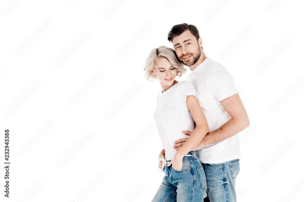 Beautiful smiling couple hugging isolated on white