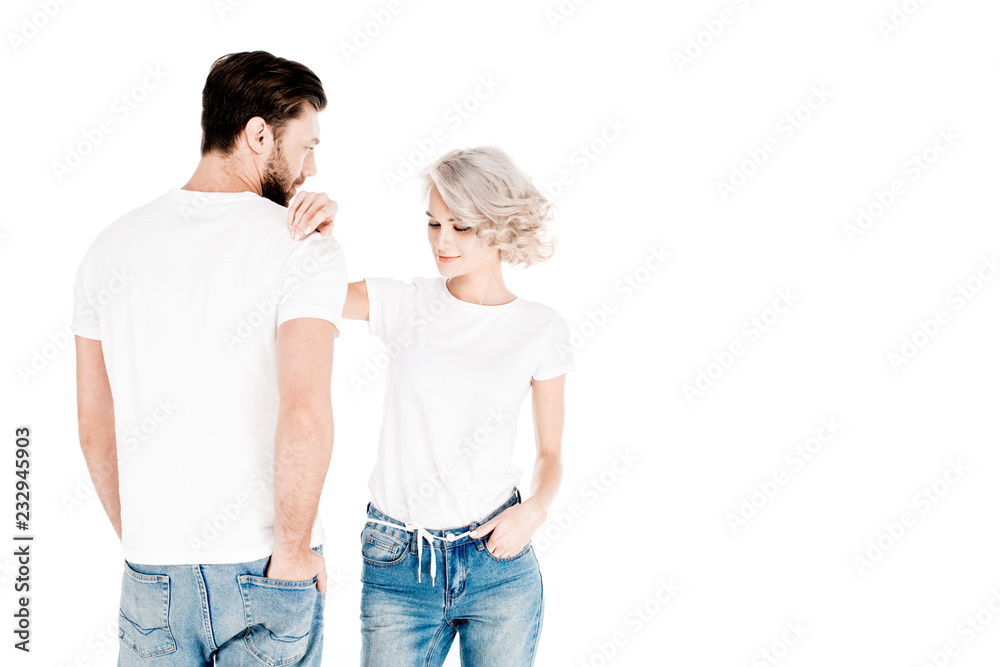 Wonderful young adult couple in white t-shirts isolated on white Wonderful young adult couple in white t-shirts isolated on white