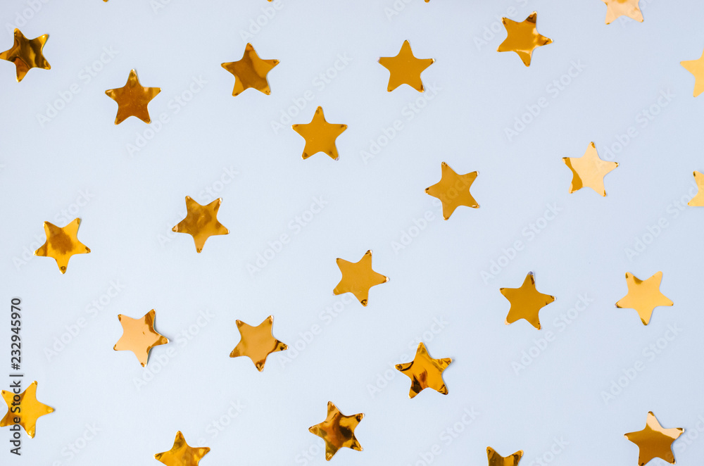 Christmas blue background with a lot of golden stars. Christmas blue background with a lot of golden stars.
