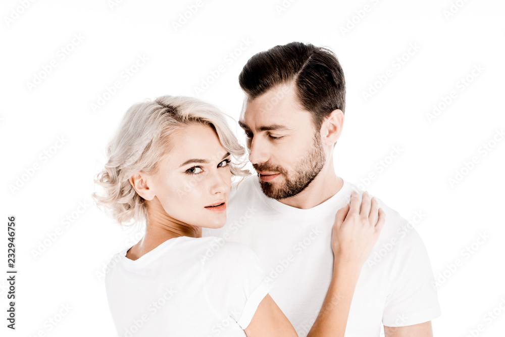 Attractive young adult couple hugging isolated on white Attractive young adult couple hugging isolated on white
