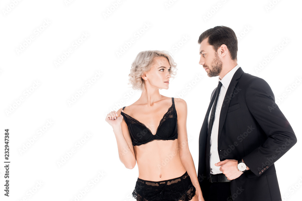 Young adult couple looking at each other isolated on white Young adult couple looking at each other isolated on white
