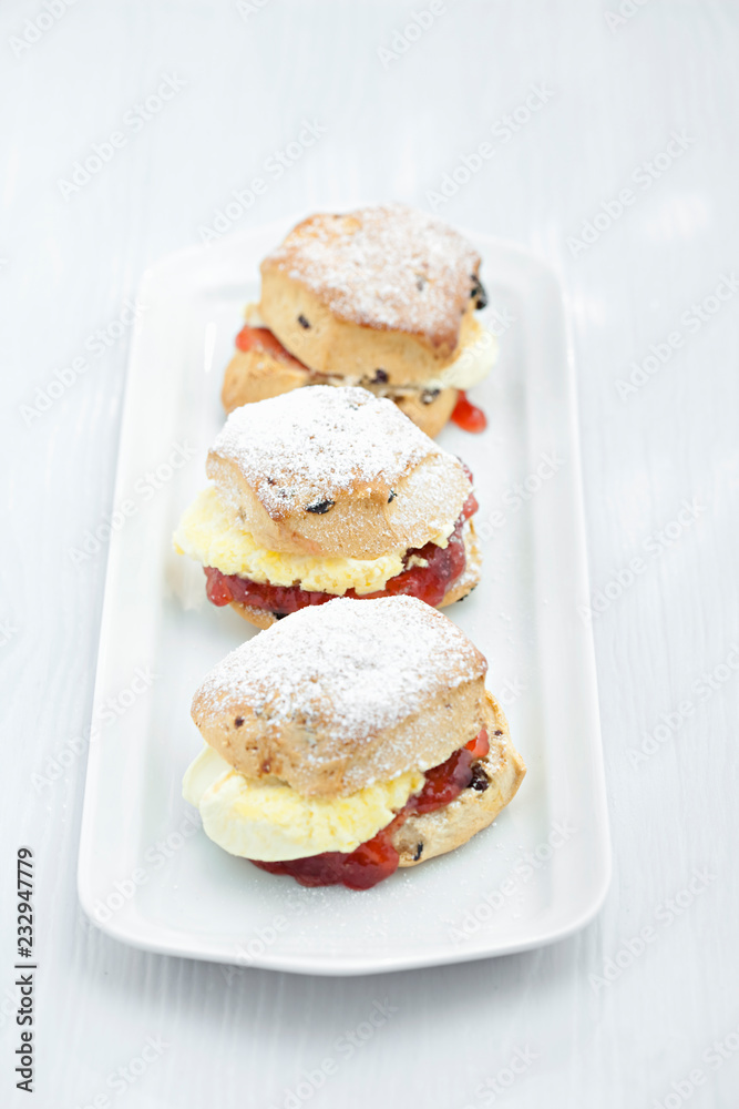 scones with strawberry jam and cream