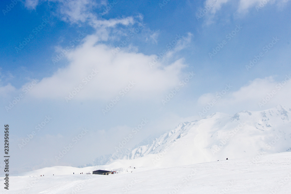Snow hill scene of tateyama mount in japan with blue sky Snow hill scene of tateyama mount in japan with blue sky