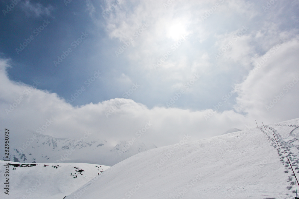 Snow hill scene of tateyama mount in japan with blue sky Snow hill scene of tateyama mount in japan with blue sky