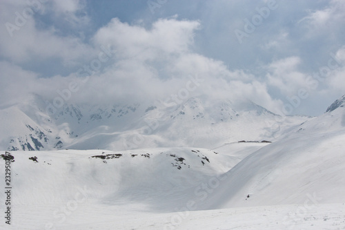 Snow hill scene of tateyama mount in japan with blue sky