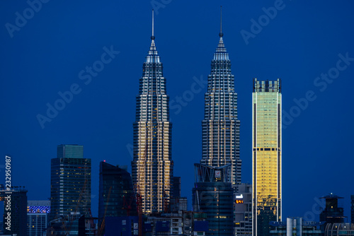 KUALA LUMPUR, MALAYSIA - 11th NOV 2018; First light over Petronas Twin Towers,  a pair of glass and steel clad skyscrapers (451m). 