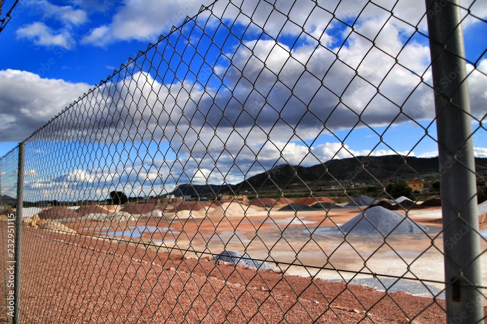 Colorful construction aggregate mountains in Spain Colorful construction aggregate mountains in Spain