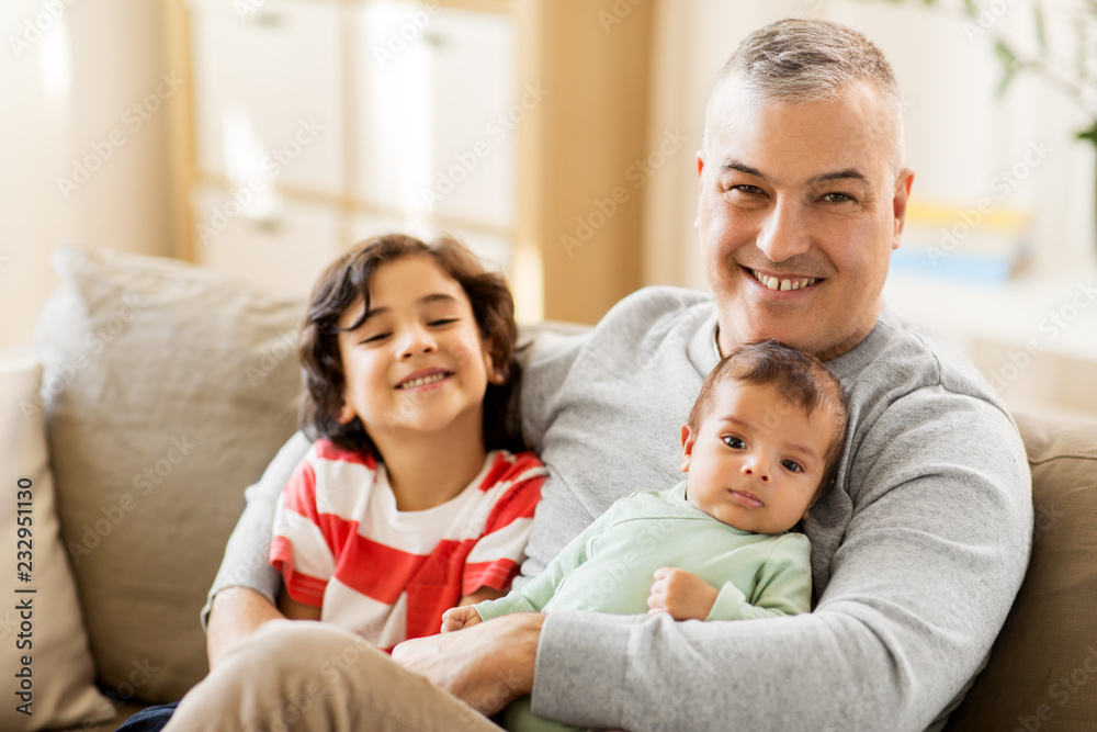 Fototapeta premium family, fatherhood and people concept - happy father with preteen and baby son at home