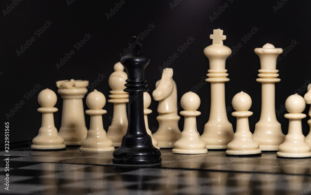 Plastic chess closeup on a black background. A game Plastic chess closeup on a black background. A game