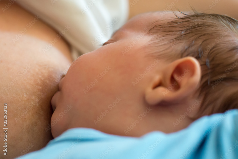 Baby eating mother's milk. Mother breastfeeding baby. Baby eating mother's milk. Mother breastfeeding baby.