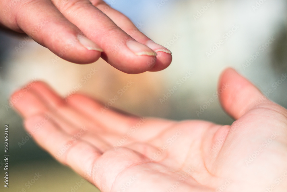 Senior and young hands, bokeh background Senior and young hands, bokeh background