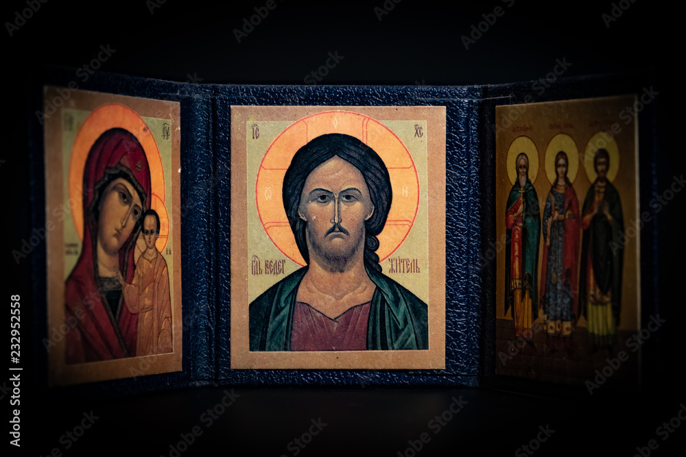 Fototapeta premium old orthodox paintings in a Greek Church on black background