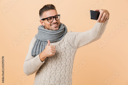 Portrait if a smiling man dressed in sweater