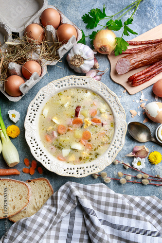 The sour rye soup made of soured rye flour and meat photo