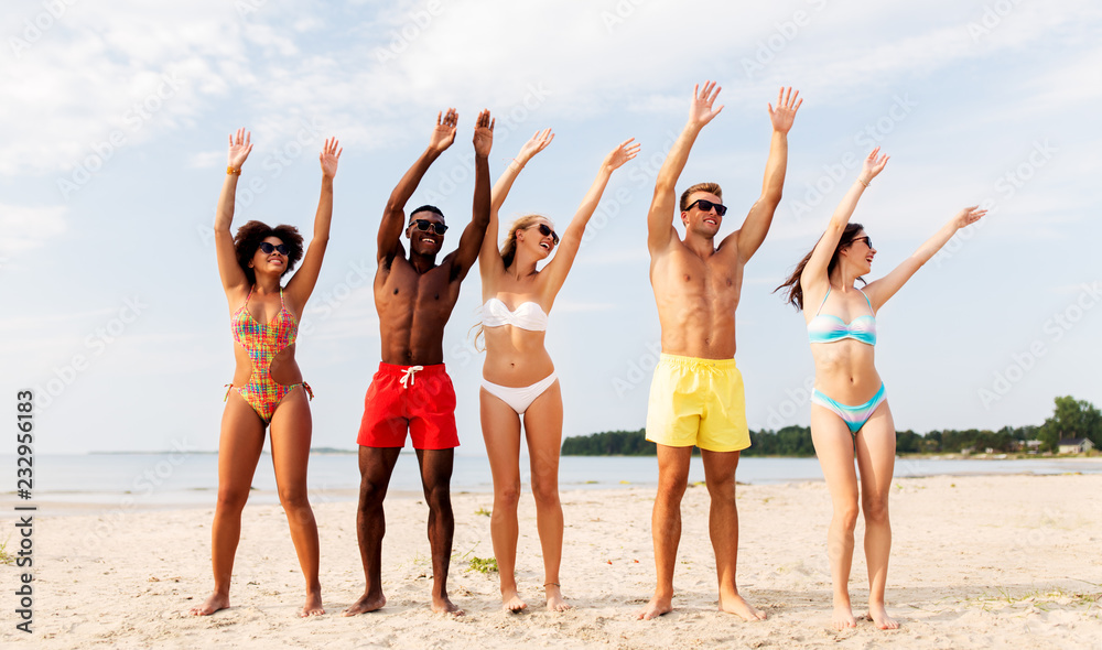friendship, summer holidays and people concept - group of happy friends having fun on beach friendship, summer holidays and people concept - group of happy friends having fun on beach