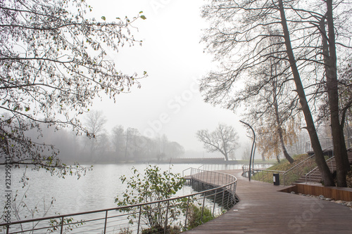 Derevyannaya Embankment in foggy day photo