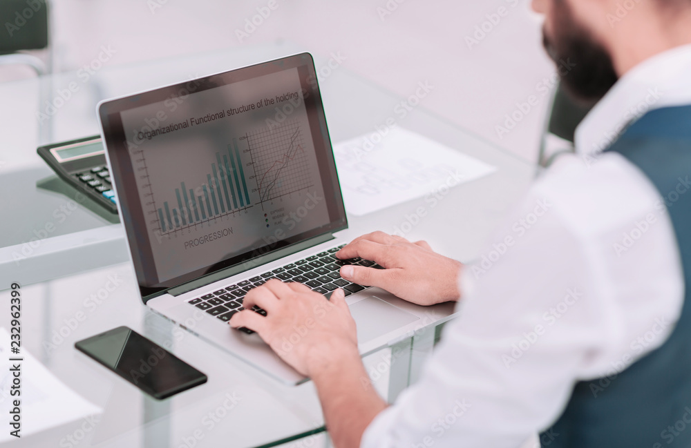 close up.businessman typing on laptop in office close up.businessman typing on laptop in office
