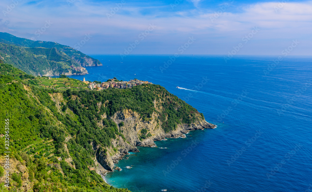 Corniglia - Village of Cinque Terre National Park at Coast of Italy. In the background you can see Manarola. Province of La Spezia, Liguria, in the north of Italy - Travel destination in Europe.