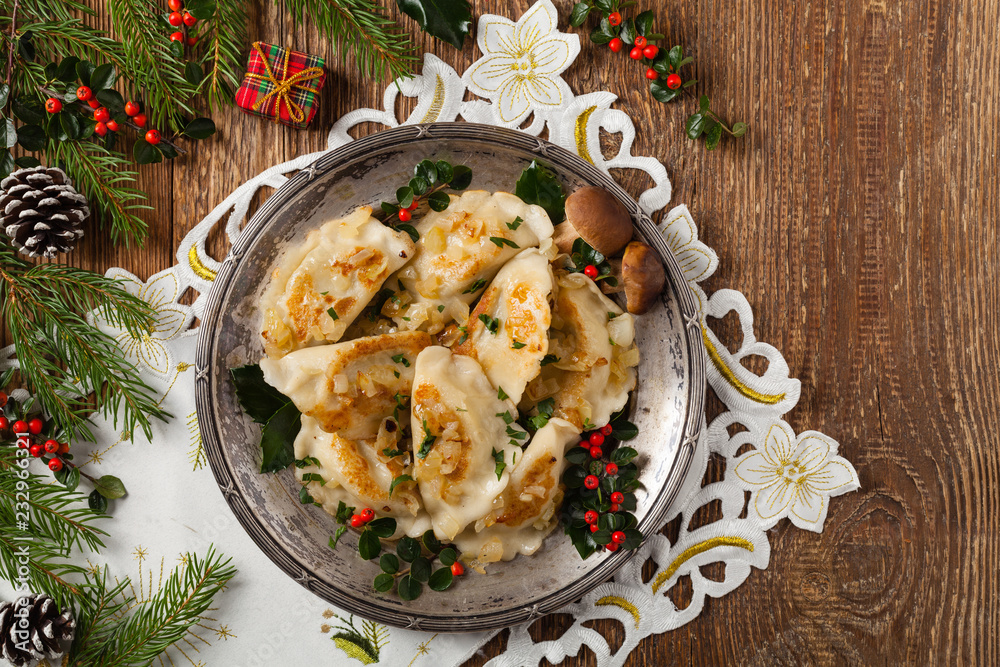 Traditional dumplings with cabbage and mushrooms. Christmas decoration.