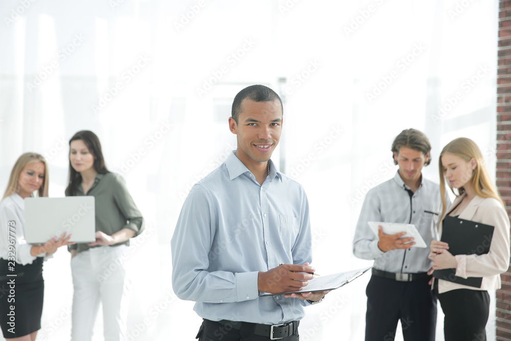 employees of the company before the meeting, standing in the lobby of the office employees of the company before the meeting, standing in the lobby of the office